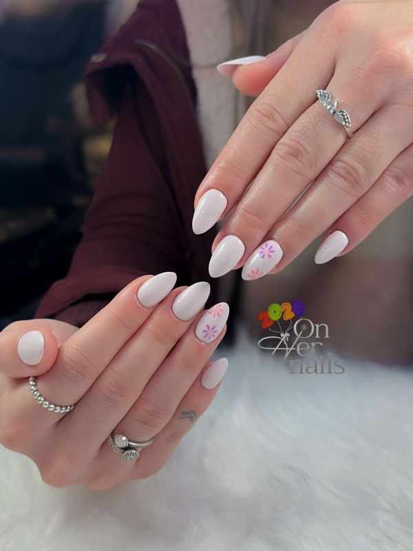 Chic Milky White Almond Nails with Minimalist Floral Art - On Her Nails